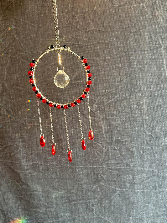 Silver hoop wire wrapped with onyx and red glass beads